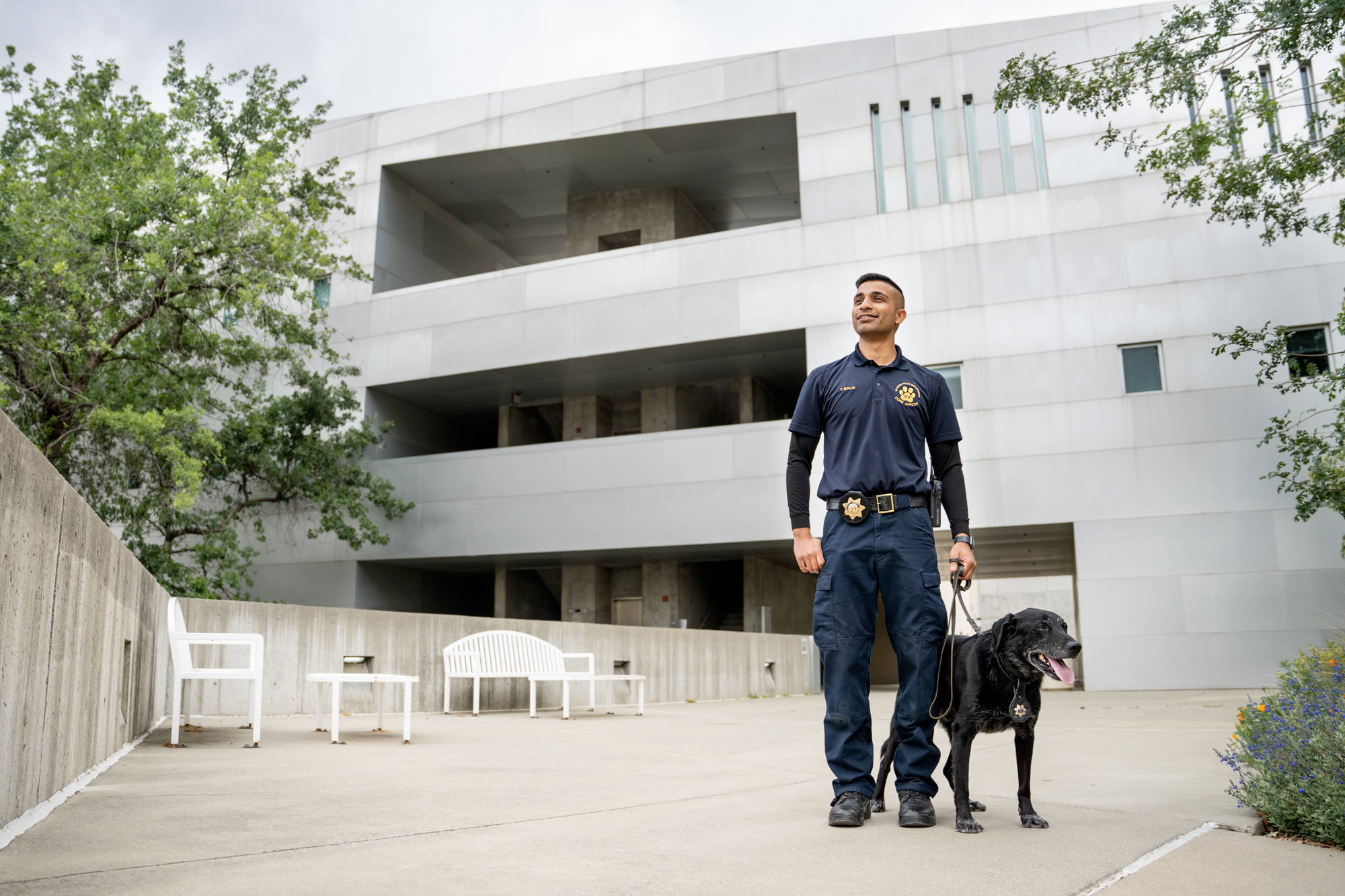 CORE Officer Malik walking K-9 Charlie