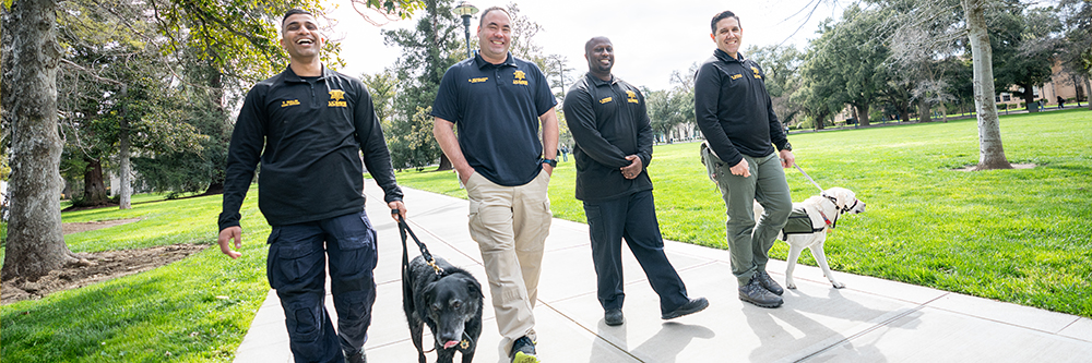 UC Davis Police CORE officers walking through the Quad.