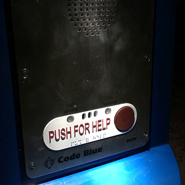 Picture of the "push for help" button on the emergency call boxes