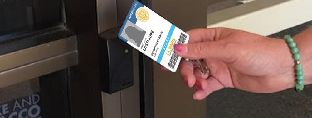 Image of person swiping their key card on a reader.
