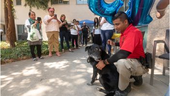 K9 Charlie next to CORE Officer Malik at Charlie's retirement party.