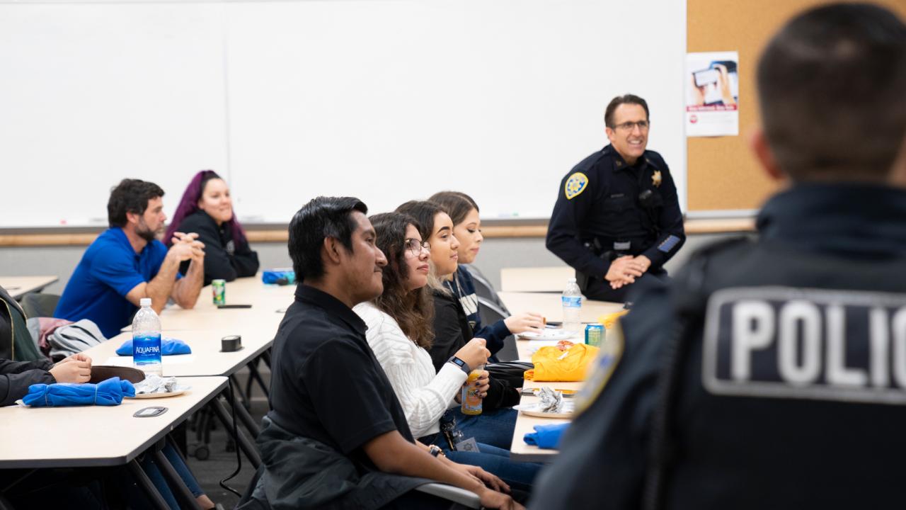 UC Davis students and community members completed a nine-week Community Police Academy on Wednesday, Dec. 4. (Photos by Anjie Cook/UC Davis) students in classroom with police officers as teachers