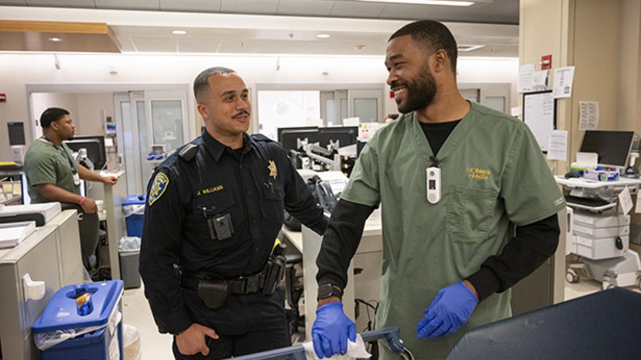 Officer greets a hospital worker