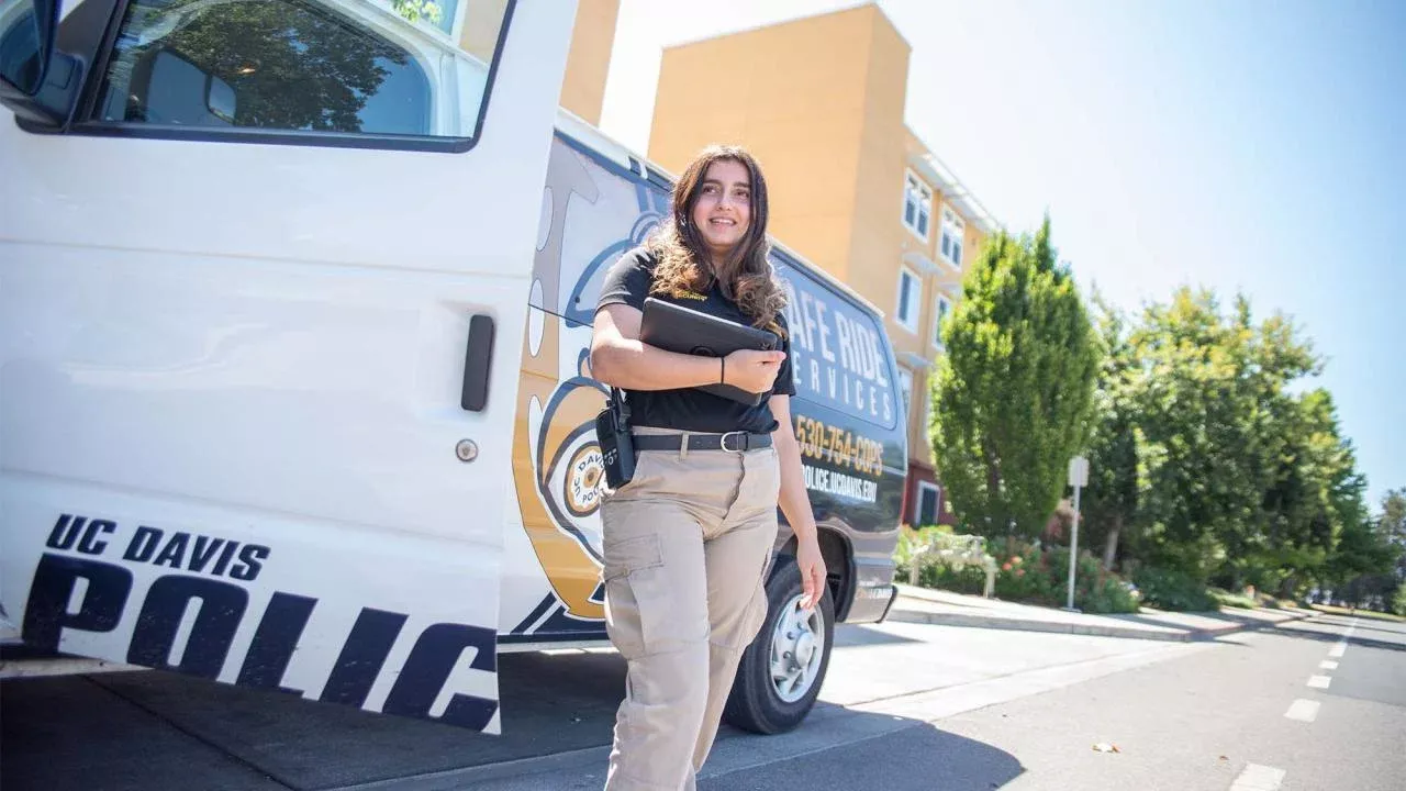Driver next to Safe Rides van.
