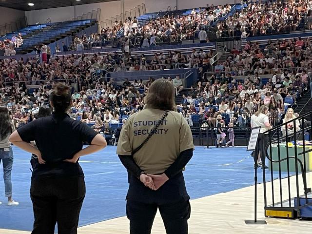Image of Aggie Host Security monitoring sporting event at the UC Credit Union Center