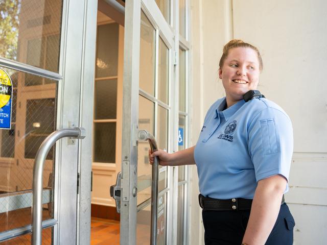 PSS officer checking doors on campus