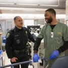 Officer greets a hospital worker