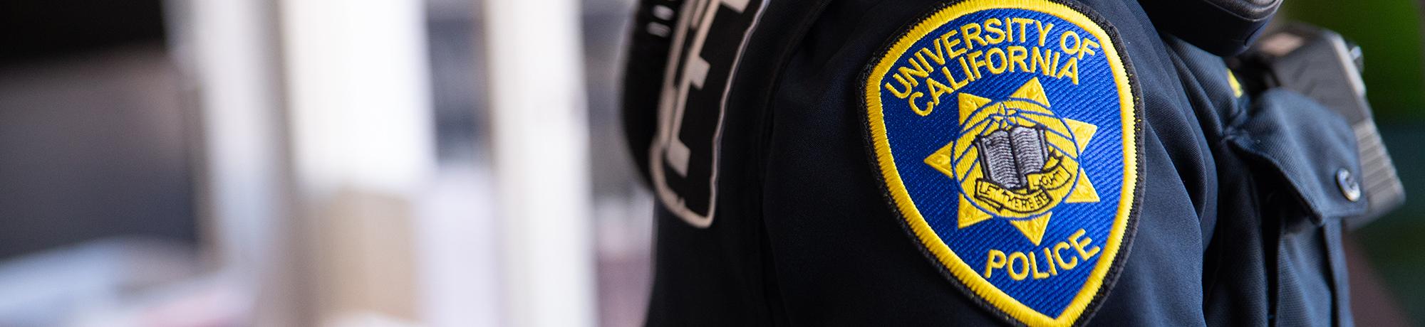 Close-up of a University of California Police Department patch on the side of an Officer's uniform