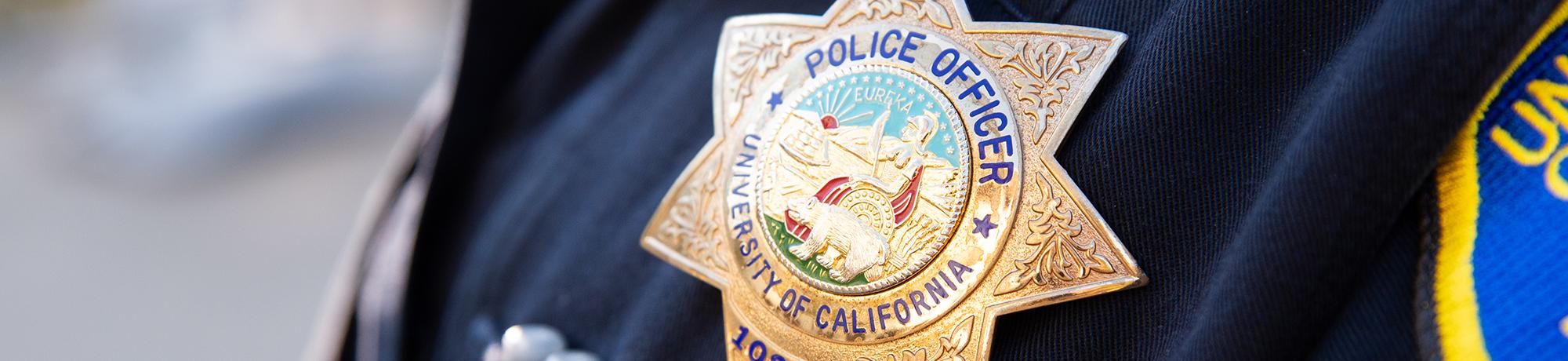 Detail shot of an officer's University of California Police Officer badge